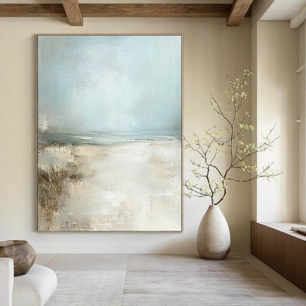 Large abstract painting featuring a serene pale blue sky and sandy beach in neutral colors for a calming ambiance.STSC095