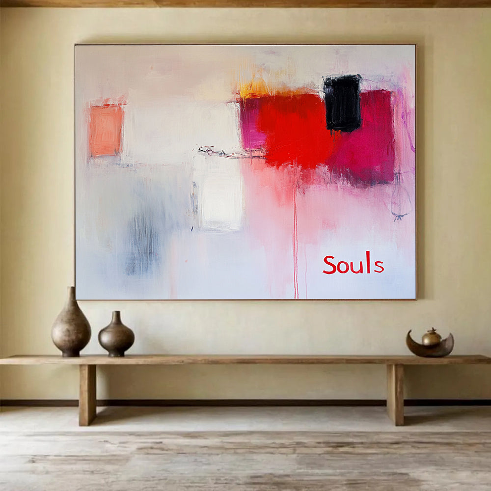 Large abstract painting in soft pinks and whites with red hints features expressive brushstrokes and the word Souls in a minimalist style.SC139