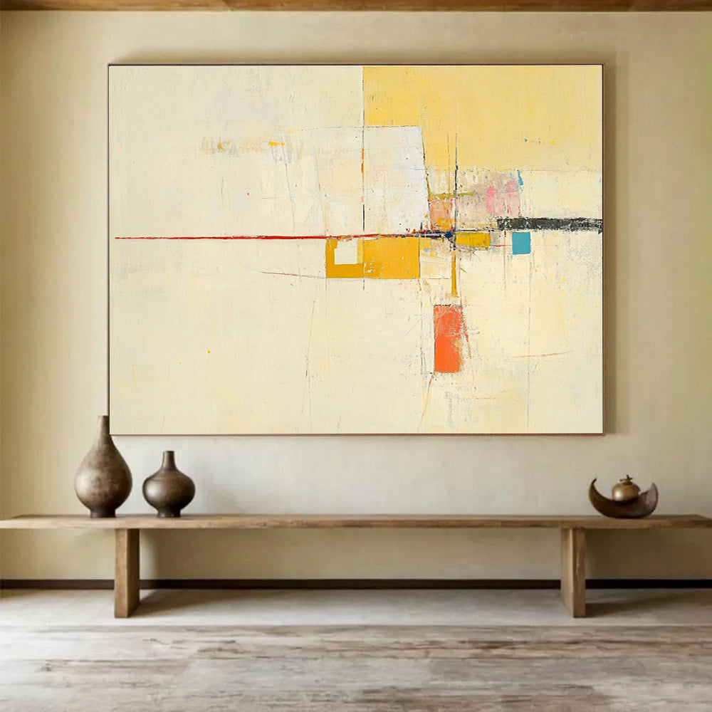 Large abstract painting featuring yellow beige colors thin red line off-white background small blue square soft orange lines geometric shapes and ample white space.SC332