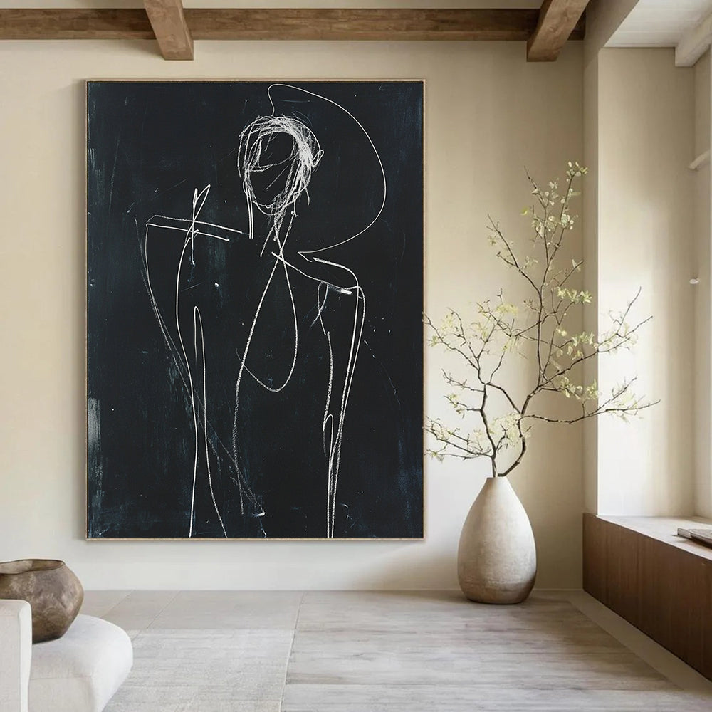 A large abstract sketch depicting a human figure in white chalk on black paper with raised arm and minimalist facial opening.STSC977