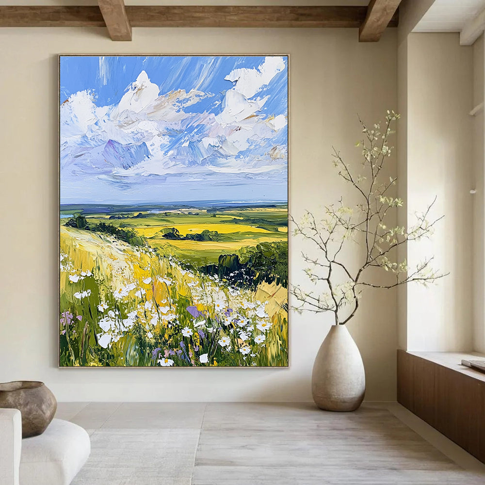 Large abstract painting of the English countryside featuring daisies under a vivid blue sky with fluffy white clouds in a whimsical style.STSC898
