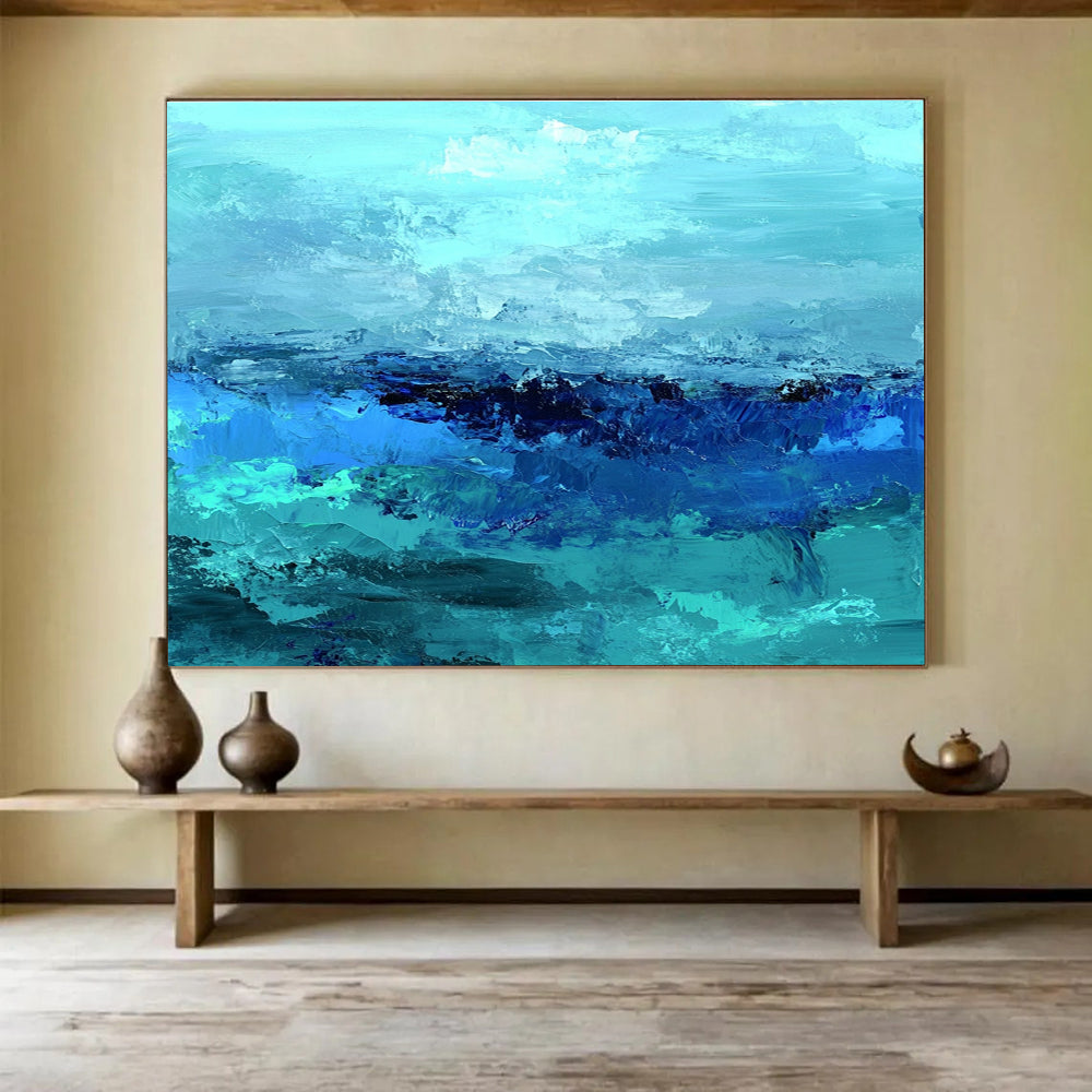 Large abstract ocean artwork in shades of aqua teal and navy with textured layers suggesting waves evokes tranquility and depth on canvas.SC035