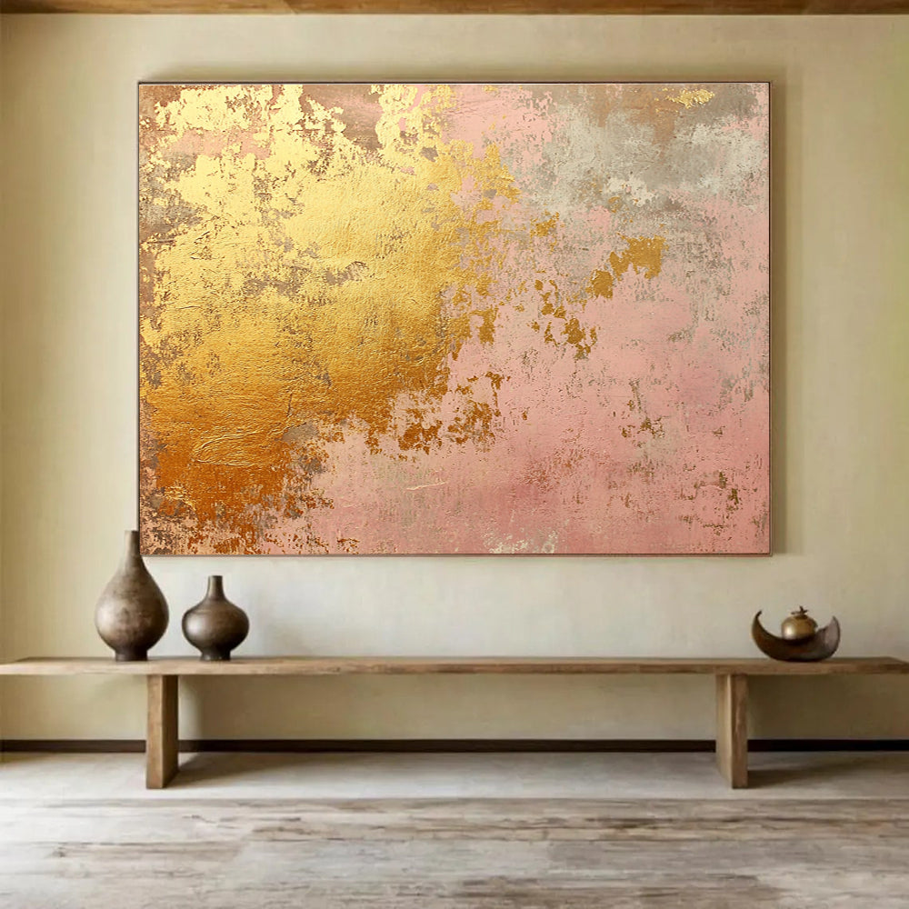 A large abstract canvas in soft pink and gold tones evokes rustic charm with weathered texture and hints of rust, ideal for home decor.SC480
