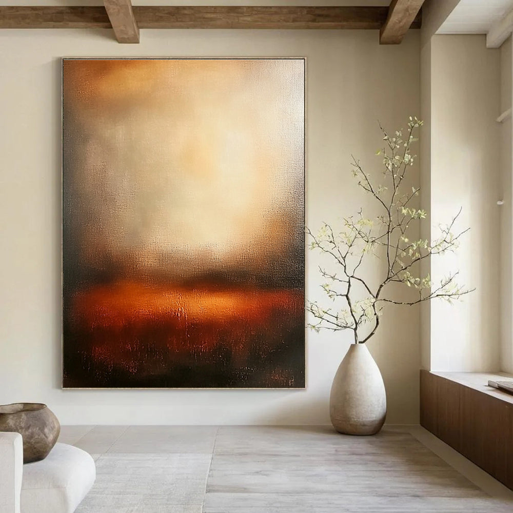 Large abstract painting featuring warm sunset colors with blurred edges and wide brush strokes evoking tranquility and emotional depth in a serene atmosphere.STSC111