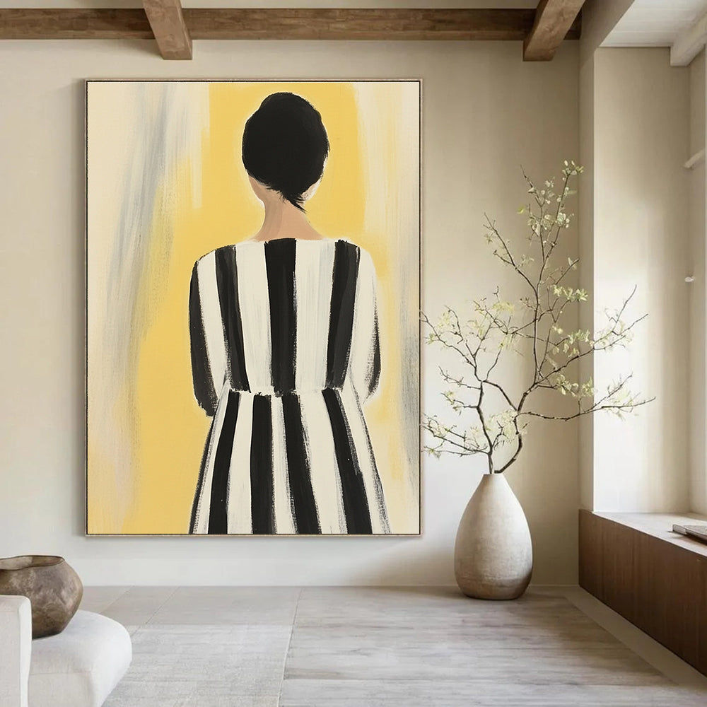 An abstract painting of a woman in a striped dress showcases feminine colors against a soft yellow background with bold black and white stripes.STSC1259