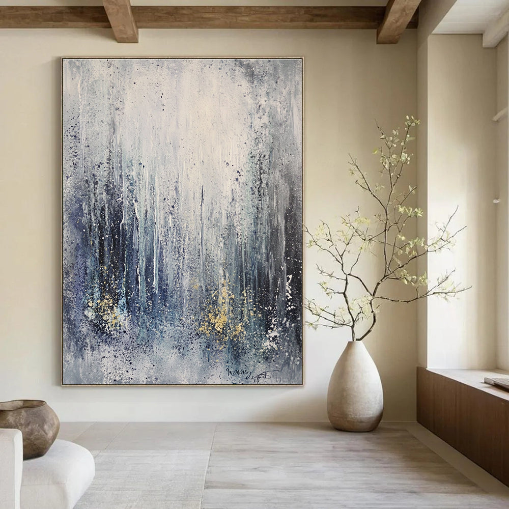 Large abstract painting capturing an ice storm featuring frozen waterfalls and icicles in gray tones with splashes of gold and blue.STSC607