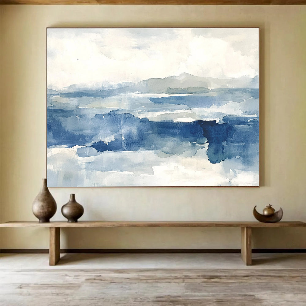 Large abstract painting of the sea features shades of blue and gray with soft clouds, evoking a stormy atmosphere and depth.SC289