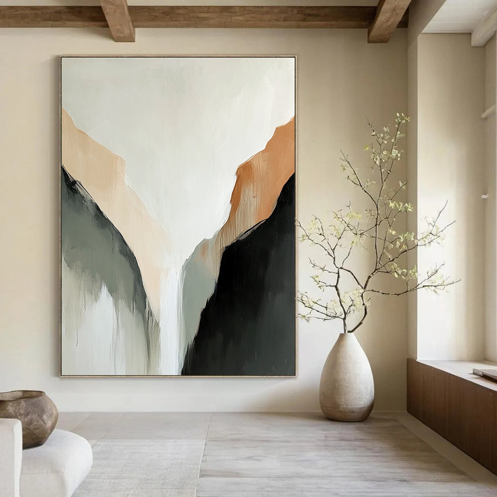 Large abstract painting of a tranquil mountain range in muted beige and black tones against a serene white background.STSC652