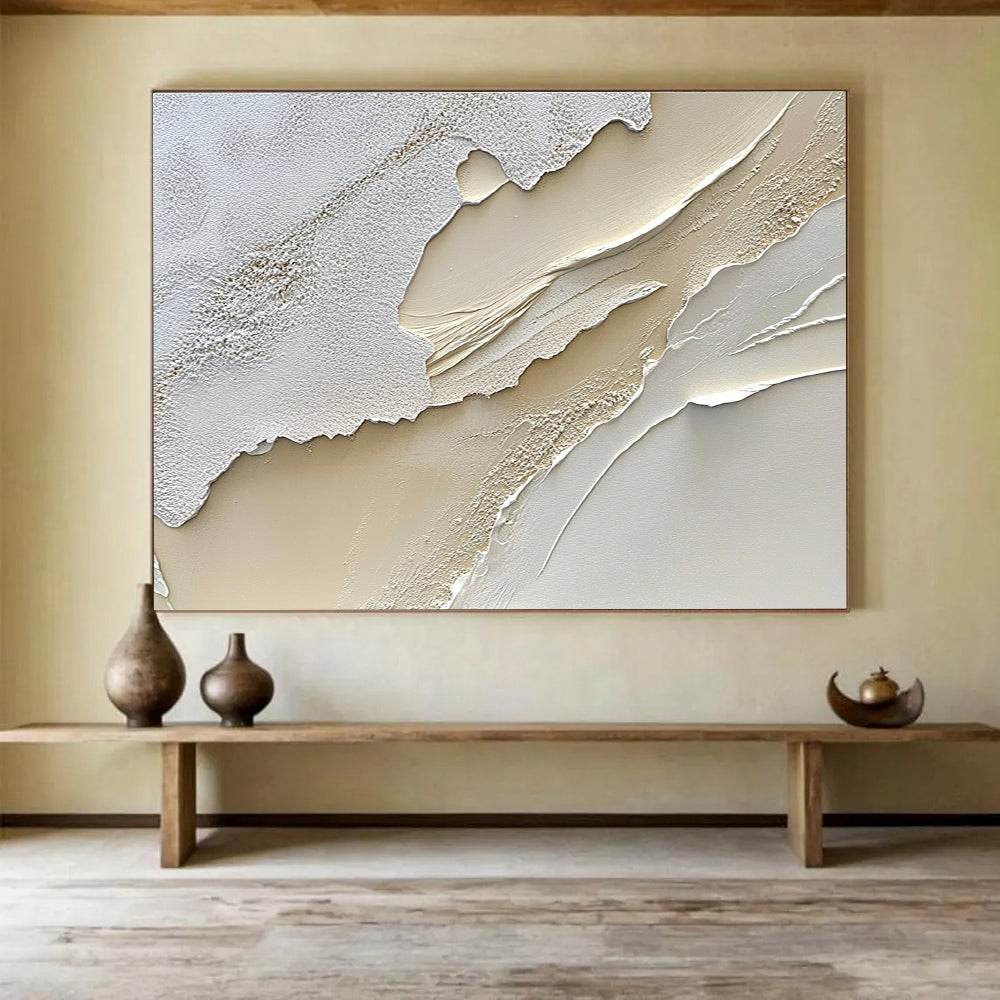 An abstract painting featuring a textured cream-colored surface reminiscent of sand dunes in soft white and beige tones.SC459
