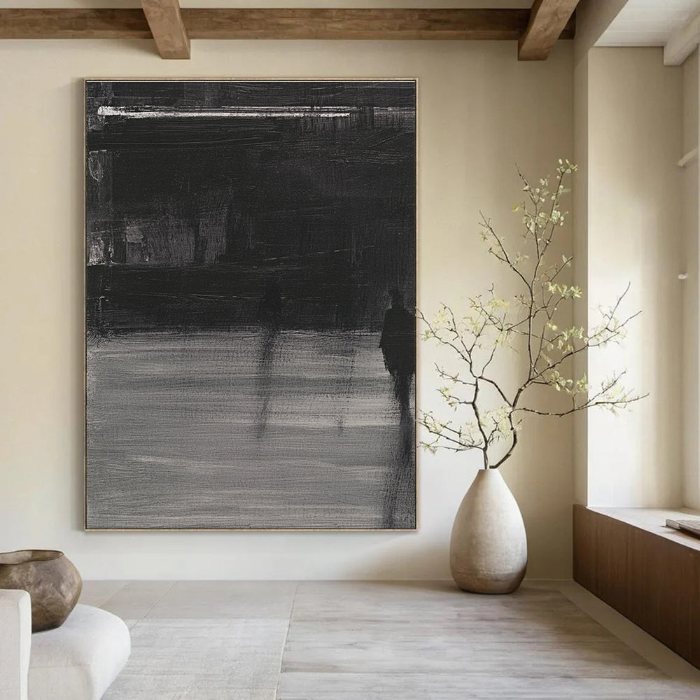 Large abstract painting featuring deep gray tones bold brushstrokes and a mysterious atmosphere with soft lighting and striking light shadow contrasts.STSC910