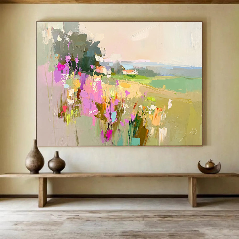Large abstract painting featuring a floral landscape with fields and a distant cottage in soothing pink purple green and blue tones.SC110
