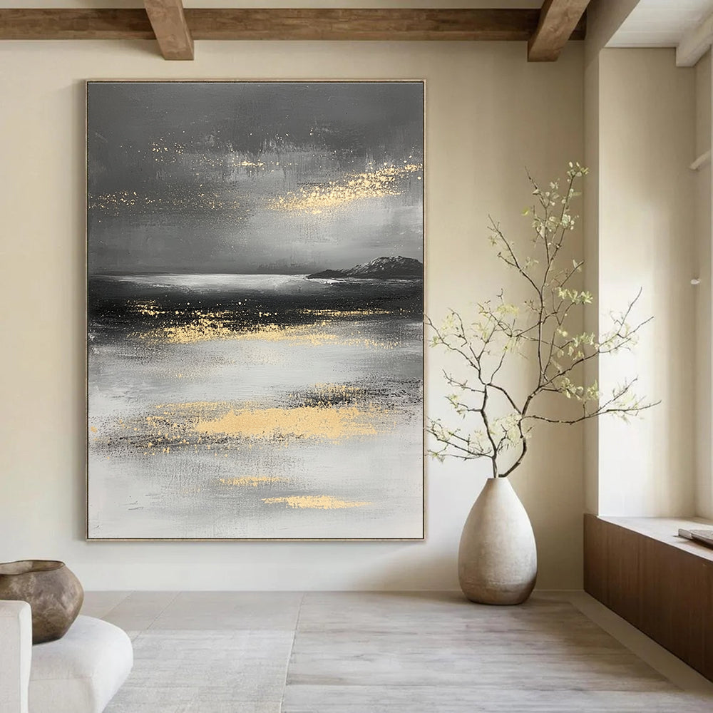 Large abstract painting in gray and white with gold accents depicting a mysterious ocean landscape and misty island.STSC064