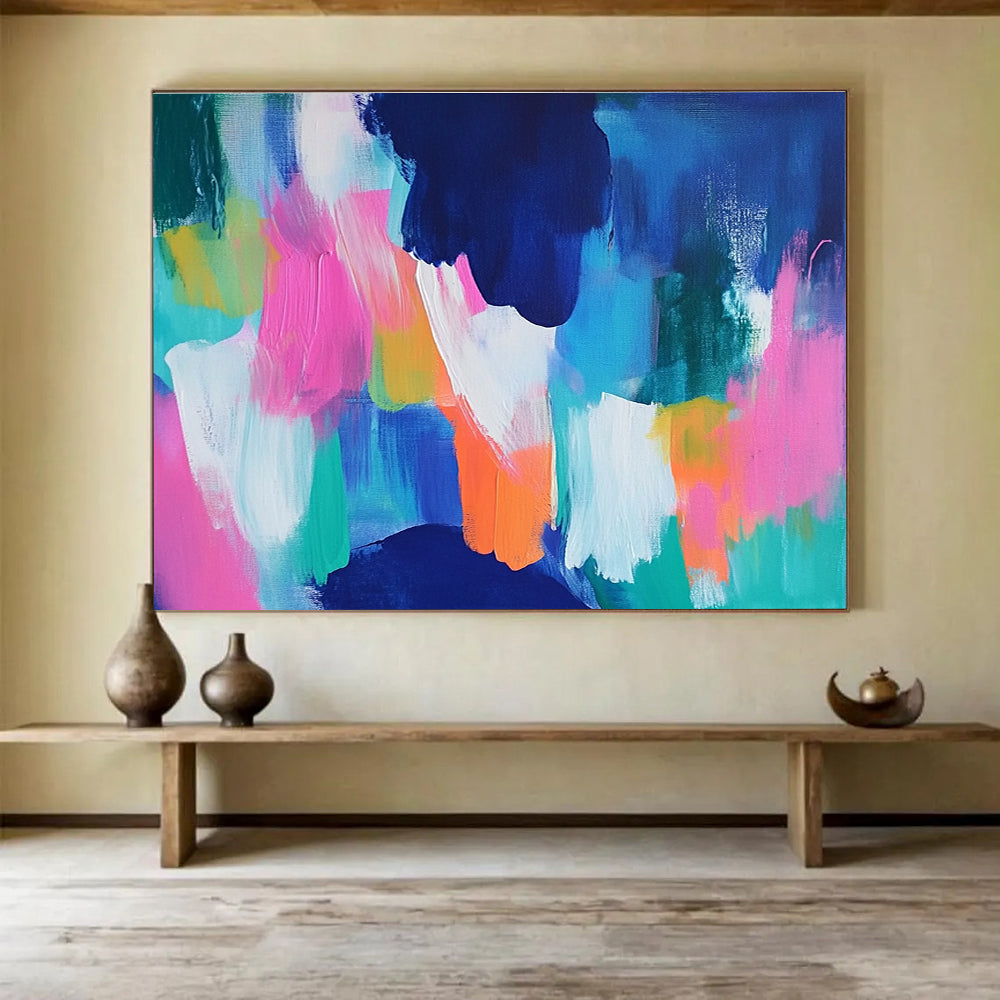 A large abstract painting with bold blue and pink backgrounds and bright orange, green, and turquoise foregrounds, conveying energy and movement.SC562