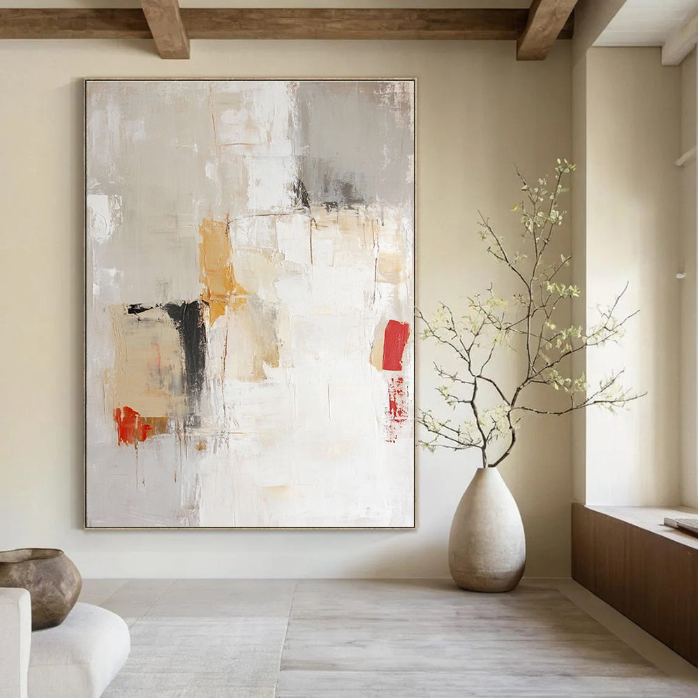 Large abstract painting in soft neutral tones of beige and white with expressive brushstrokes and hints of red and yellow.STSC801