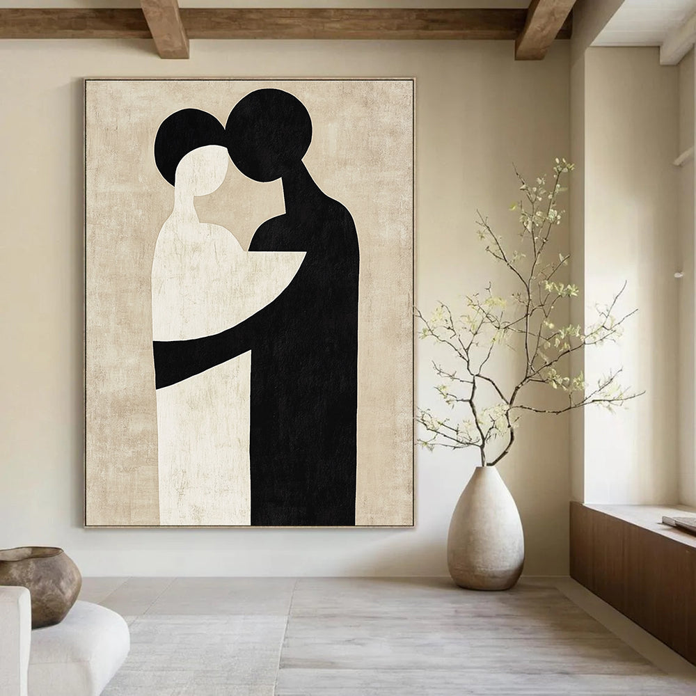 Large abstract artwork featuring black and white shapes that suggest an embrace against a neutral beige background in the style of Paul Klee.STSC473