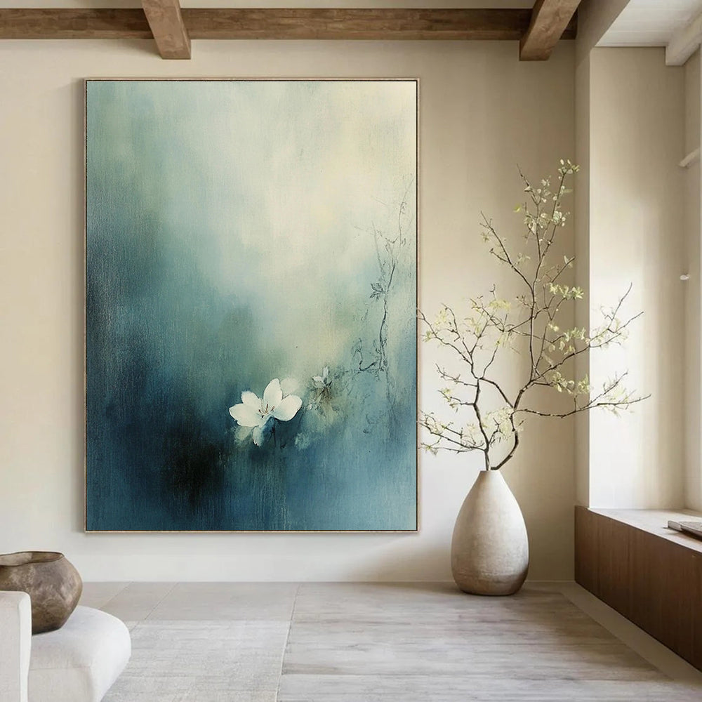 Large abstract painting featuring a small white flower blooming amid muted blue-green tones and hazy fog.STSC631