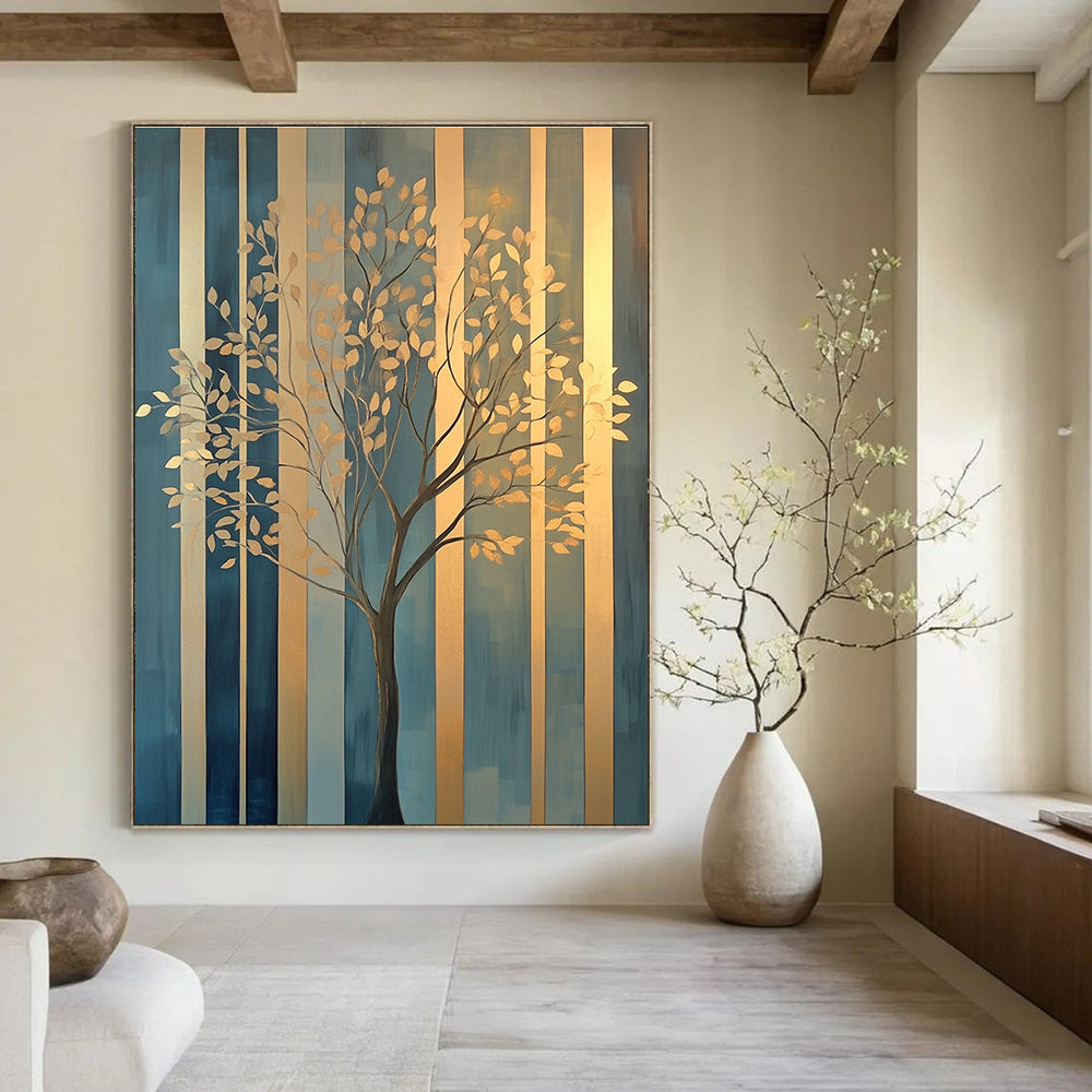 Large abstract painting featuring elegant gold tree branches against geometric blue green patterns with soft edges and a warm glow on canvas.STSC1117