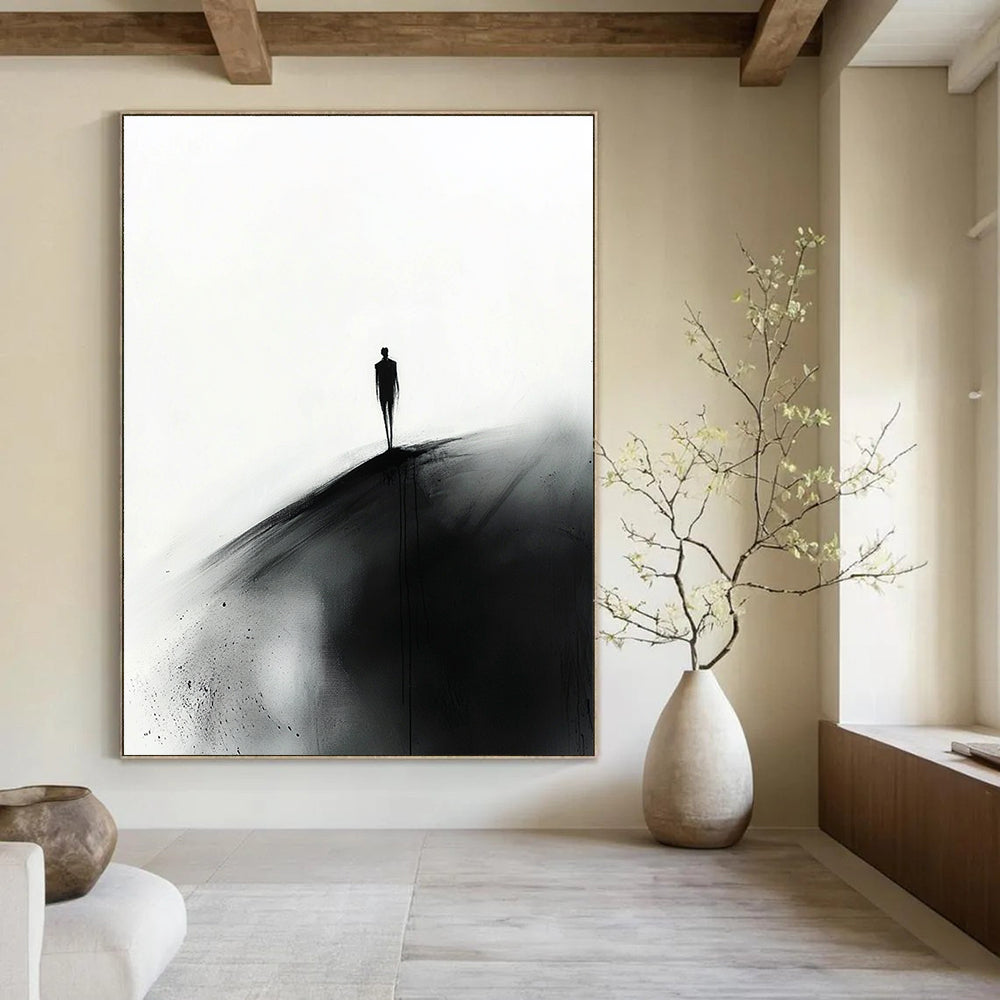 Abstract painting featuring a small silhouette of a man in black walking towards the viewer on a hill against a white ink wash background.STSC1349