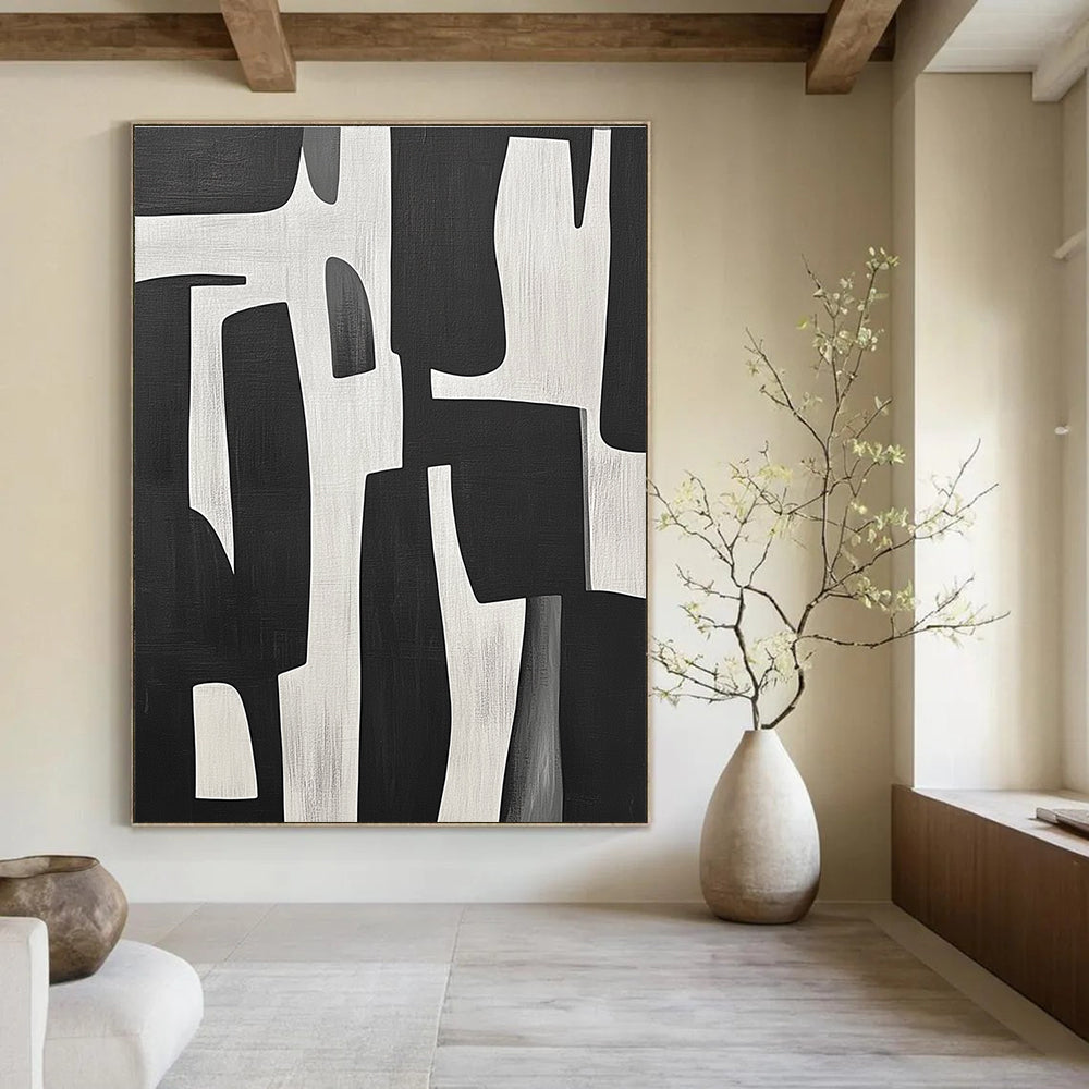 Large abstract painting of black and white shapes inspired by Jean-Paul Gaultier's style showcasing bold contrasts and dynamic forms.STSC328