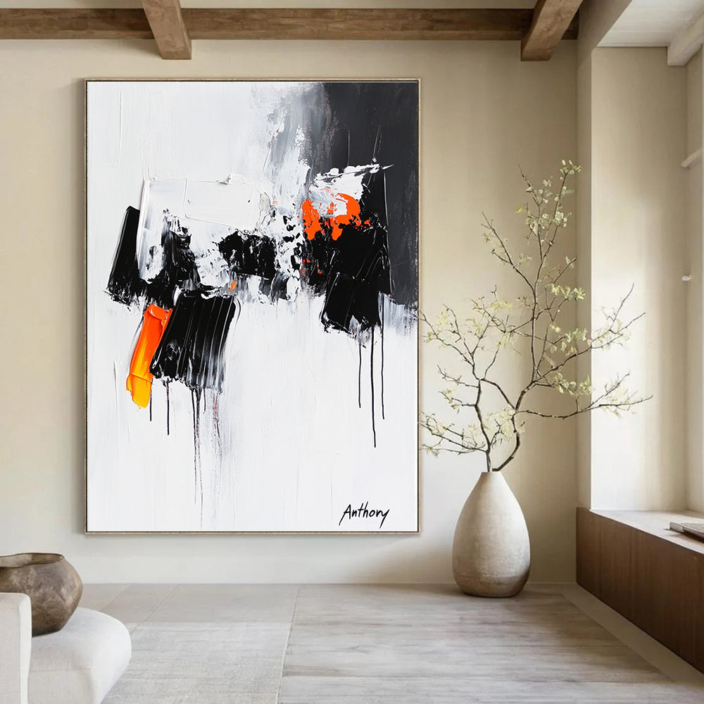 Large abstract painting featuring the word Anthony with black and orange dripping paint thick brush strokes and bold black shapes on a white background.STSC350