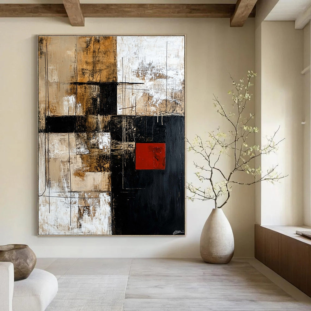 Large abstract painting in black brown beige and white with striking red square adds contrast to the dynamic design.STSC391