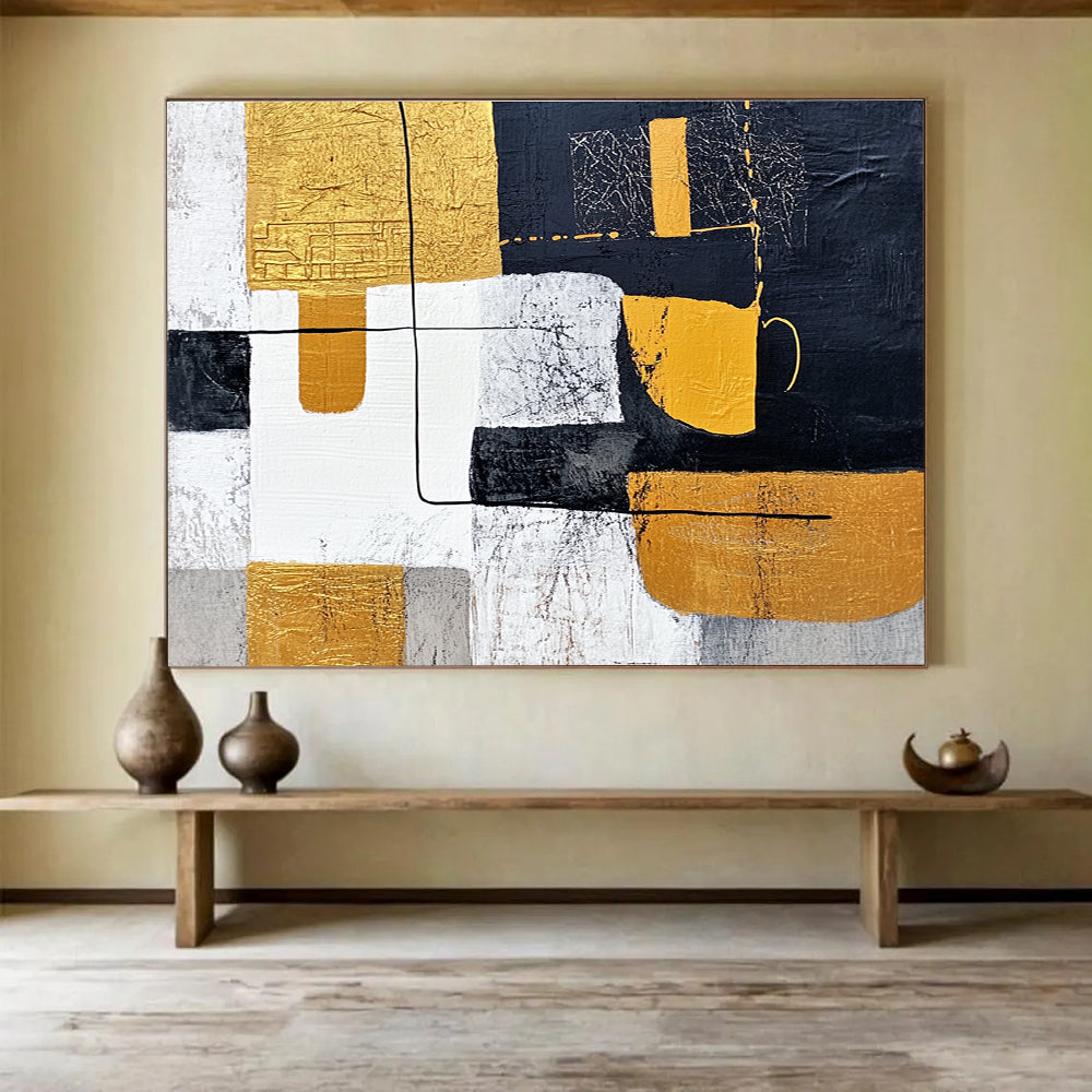 Large abstract painting featuring white and yellow shapes with black lines on a dark gray background inspired by Chinese landscapes and embellished with gold leaf.SC266