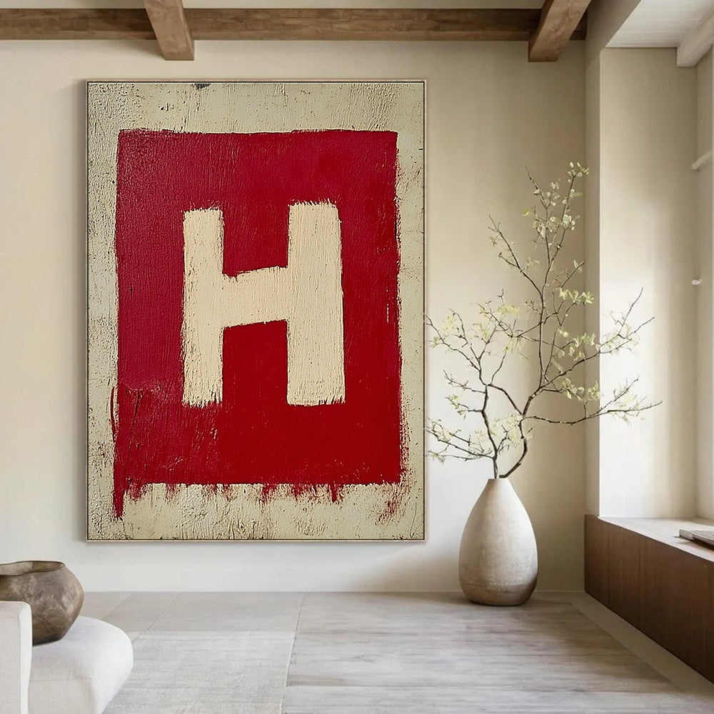 A large abstract painting featuring a minimalistic red and white letter H on textured canvas, showcasing simple brush strokes in oil paint.STSC1163