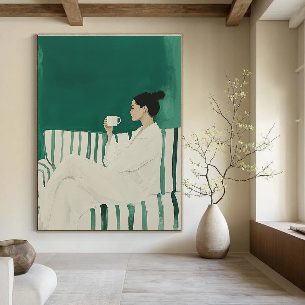 Large abstract painting featuring a woman in a white robe on a striped sofa holding a coffee mug against a green background.STSC1494
