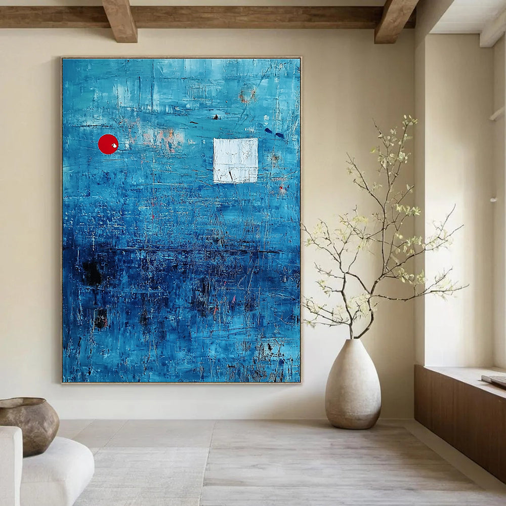 Large abstract painting featuring a serene blue ocean with textured brush strokes and dynamic black lines, accented by a small red circle and white squares.STSC041
