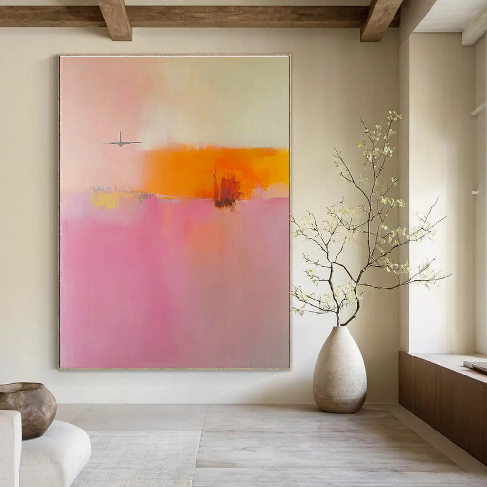 Large abstract painting in soft pink orange and yellow tones featuring blurred edges and an airplane shape in a minimalist style.STSC789