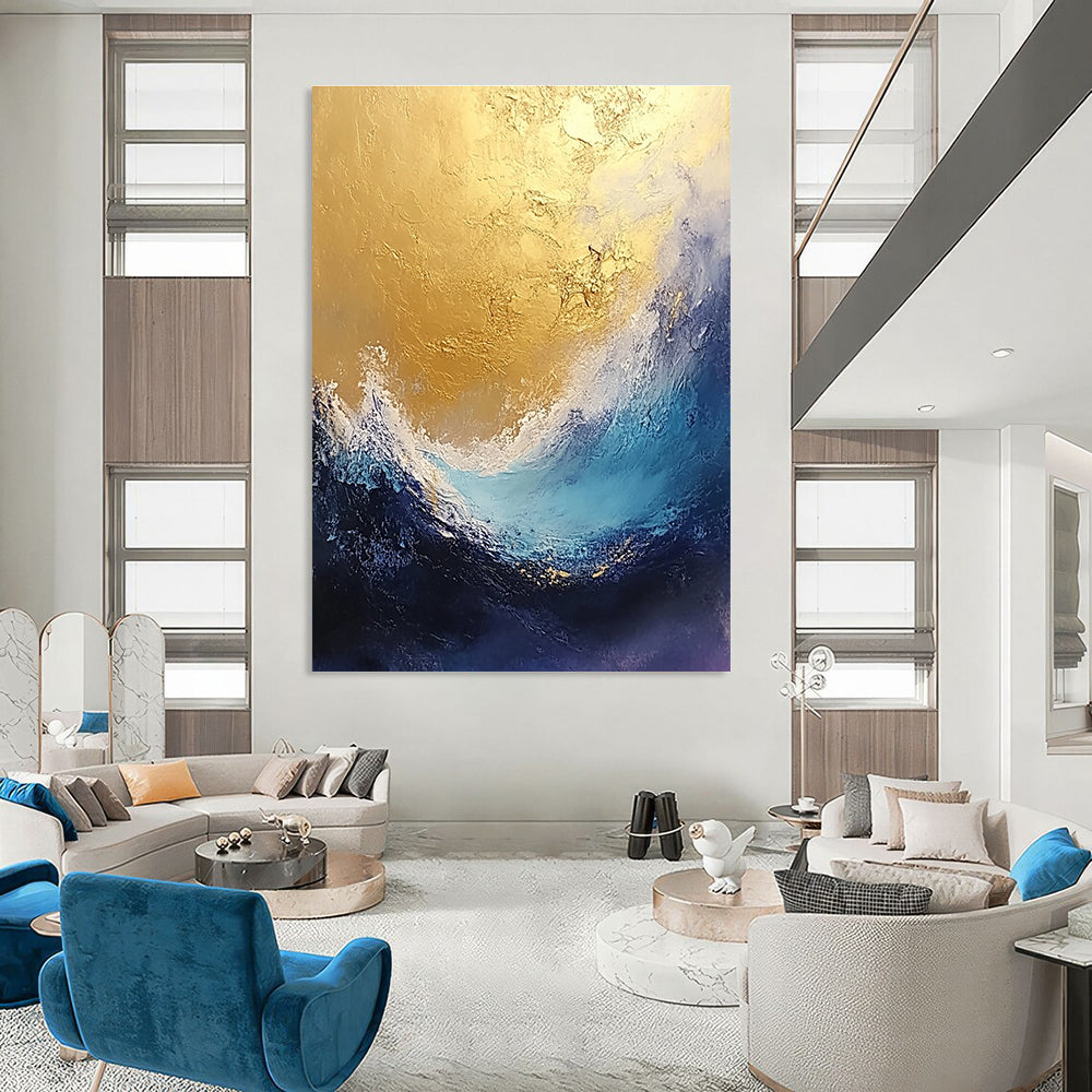 Large abstract painting depicting stormy seas in gold and blue tones with a textured finish perfect for enhancing any space.STSC334