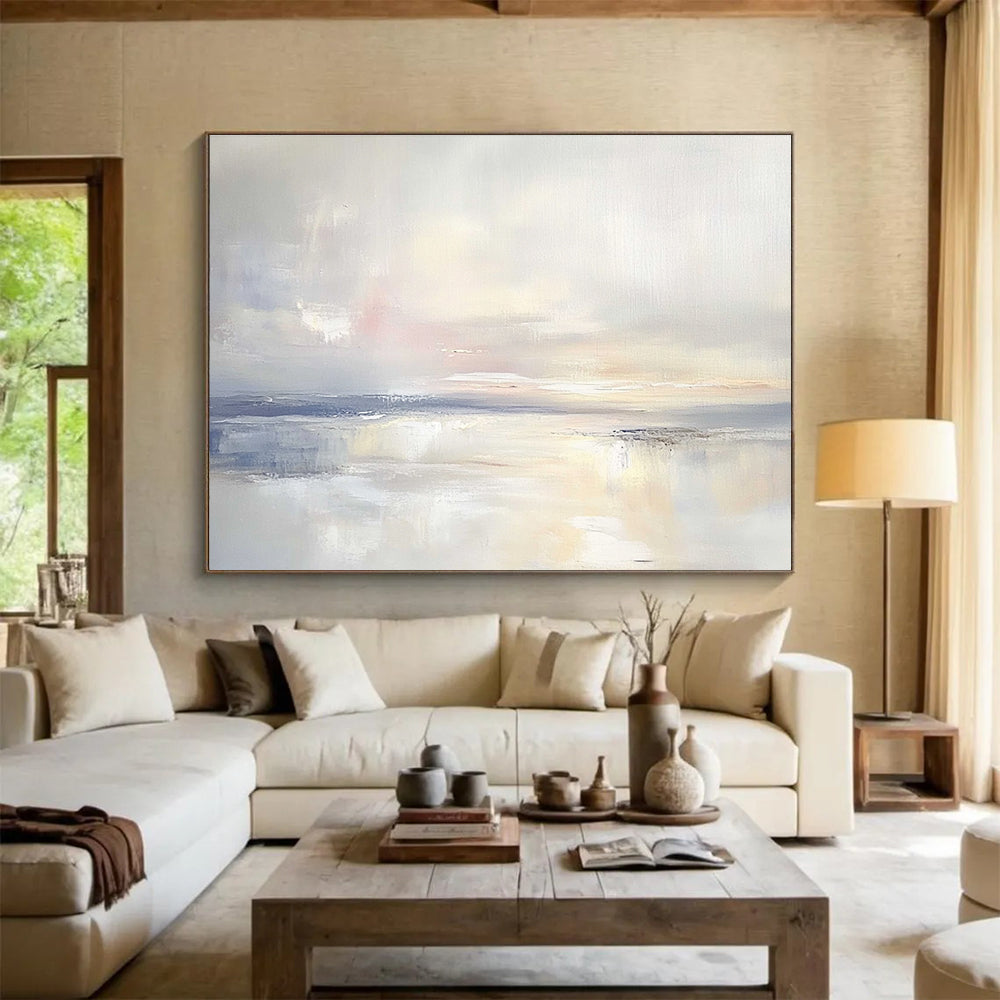 A large abstract painting featuring an open sky and gentle clouds in muted pastels, blending into serene waters for a tranquil ambiance.SC556