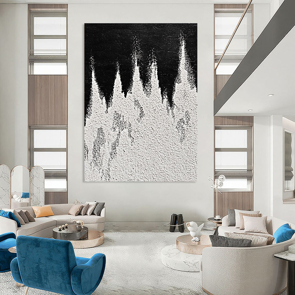 A large abstract painting featuring white powder on a black background with textured mountain ranges in playful gray and white tones capturing sharp edges.STSC1487