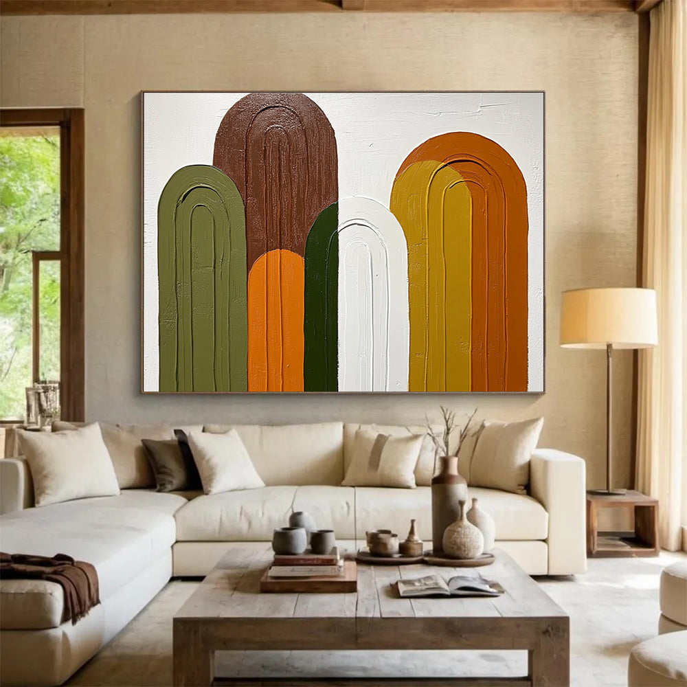 Large abstract painting featuring arches in shades of green brown and orange on a white background with simple colorful shapes.SC590