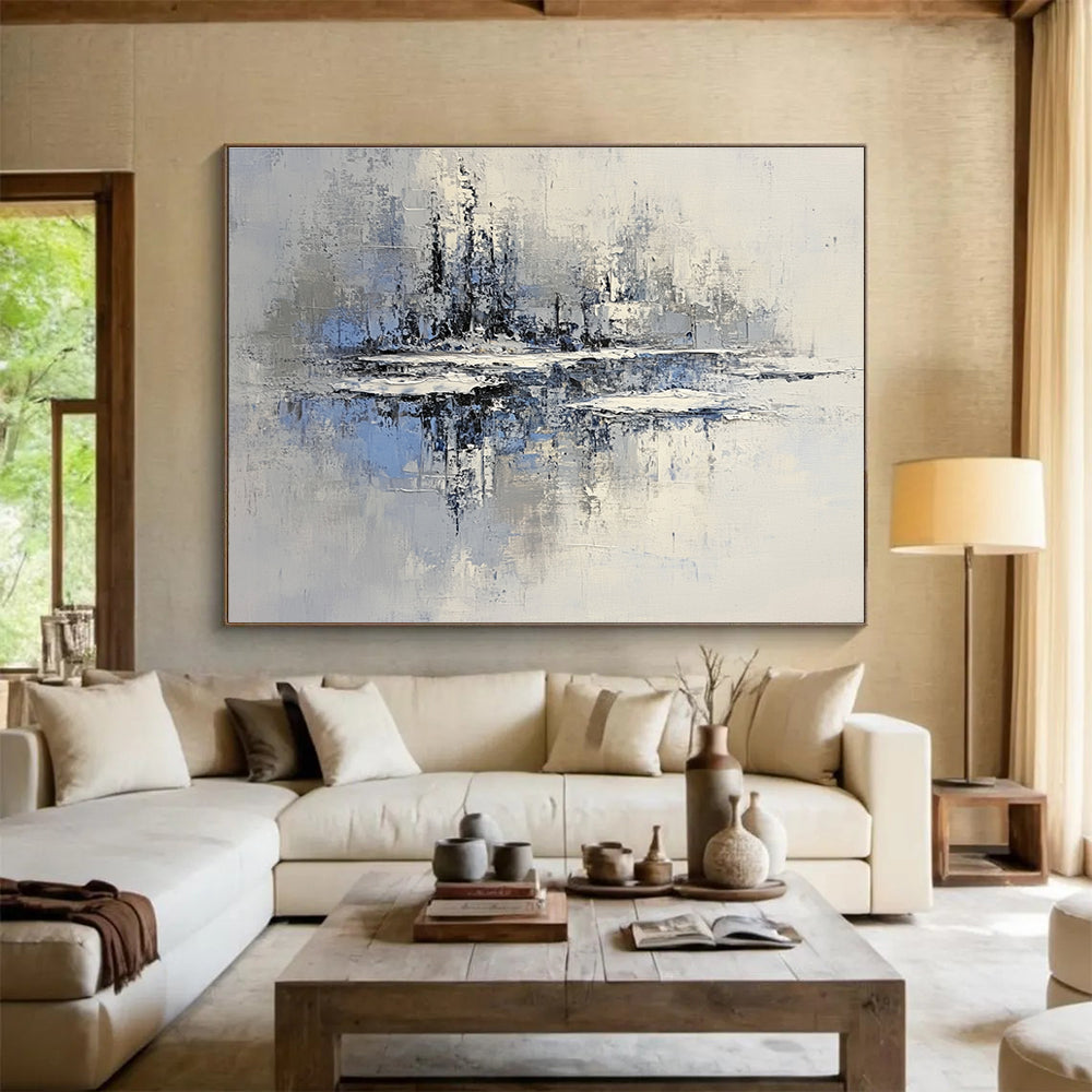 Large abstract painting of an icy lake with floating islands in muted gray and blue tones featuring textured brush strokes and serene winter lighting.SC158