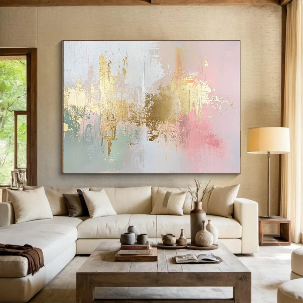 Large abstract painting in soft pink, white, and gold with hints of light green and neutral tones, featuring dynamic brush strokes and a modern art style.SC283
