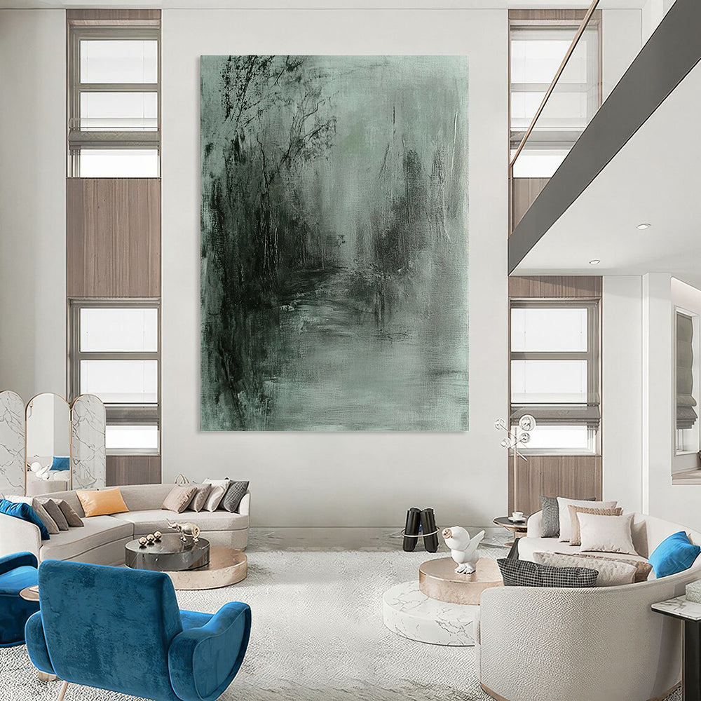 Large abstract painting in gray and green tones featuring soft edges and a dark background evokes tranquility and mystery through fluid brushstrokes.STSC419