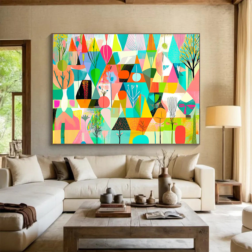 A large abstract painting featuring vibrant geometric shapes in shades of green pink blue yellow and orange with floral elements and nature motifs.SC563