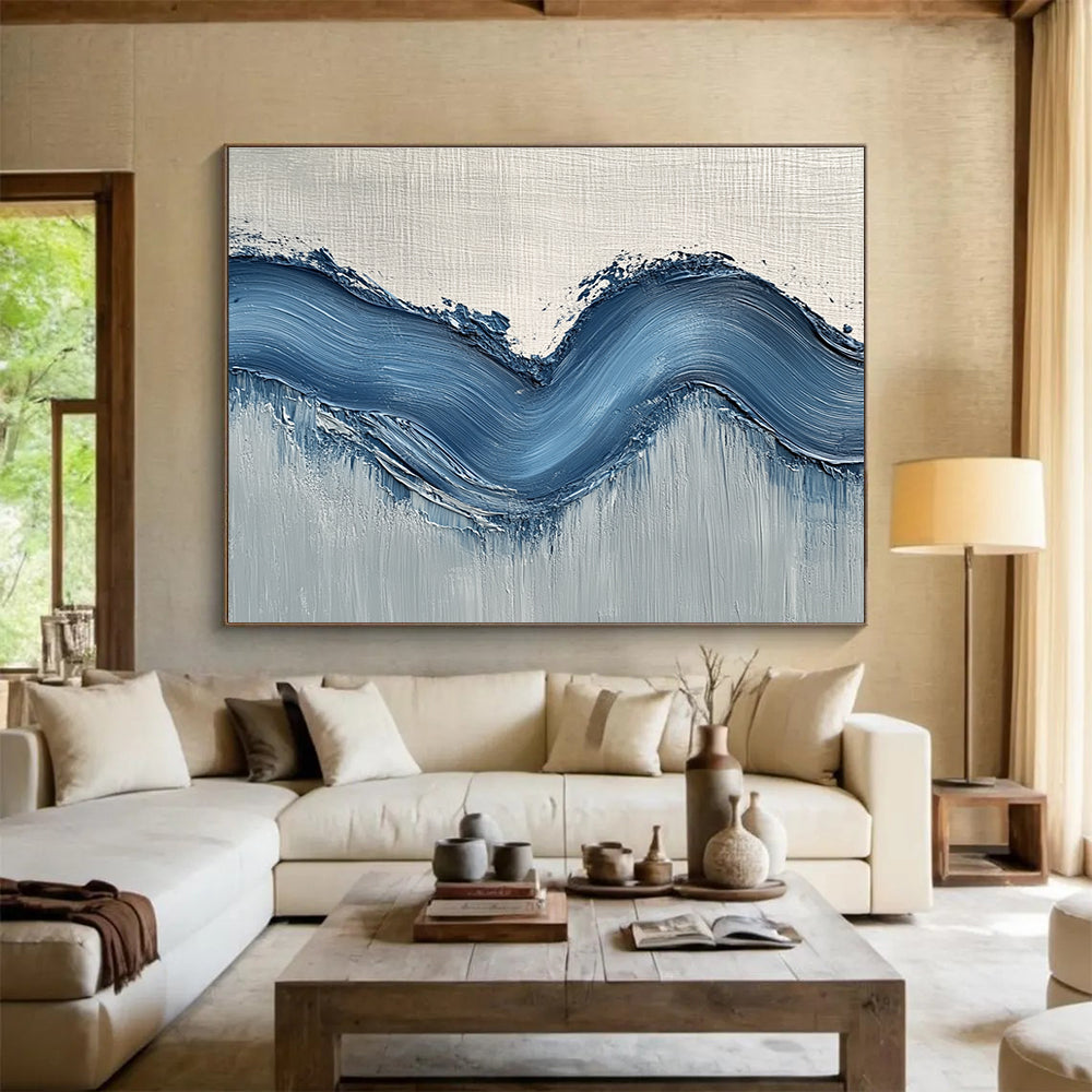 Large abstract painting with gentle blue hills on light gray wall, showcasing depth and movement for a modern aesthetic.SC453
