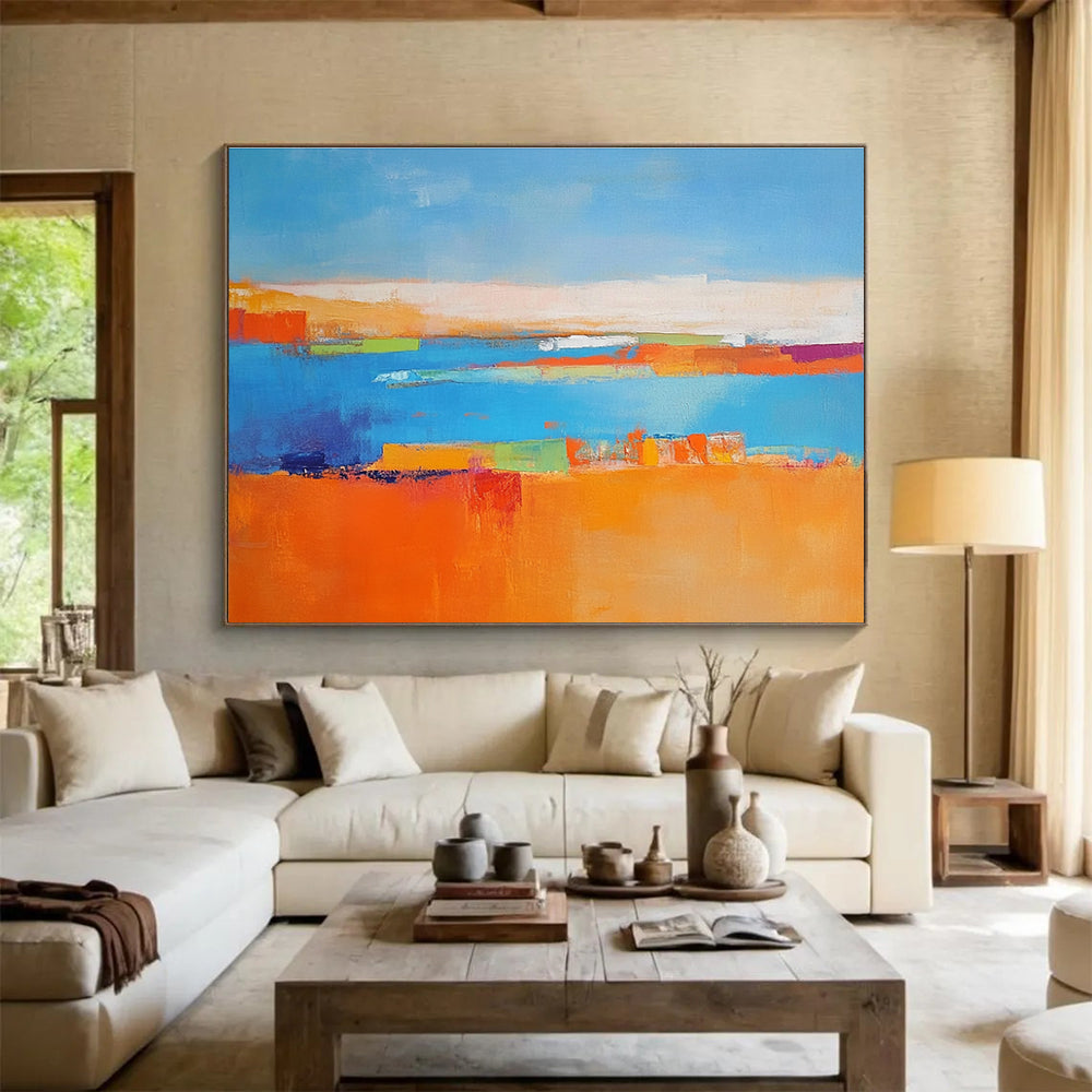 Large abstract painting featuring a soft blue background vibrant oranges geometric patterns warm yellows with green shapes and white figures symbolizing nature.SC060