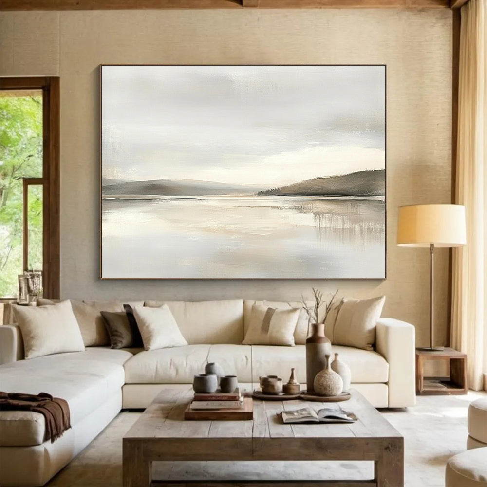 Large abstract painting featuring muted beige and gray tones with a soft sky and calm water for a tranquil and elegant atmosphere.SC065