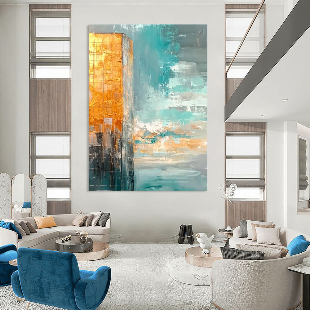 Large abstract painting featuring muted teal and gold tones with a vast sky clouds and calm water creating a serene atmosphere.STSC090