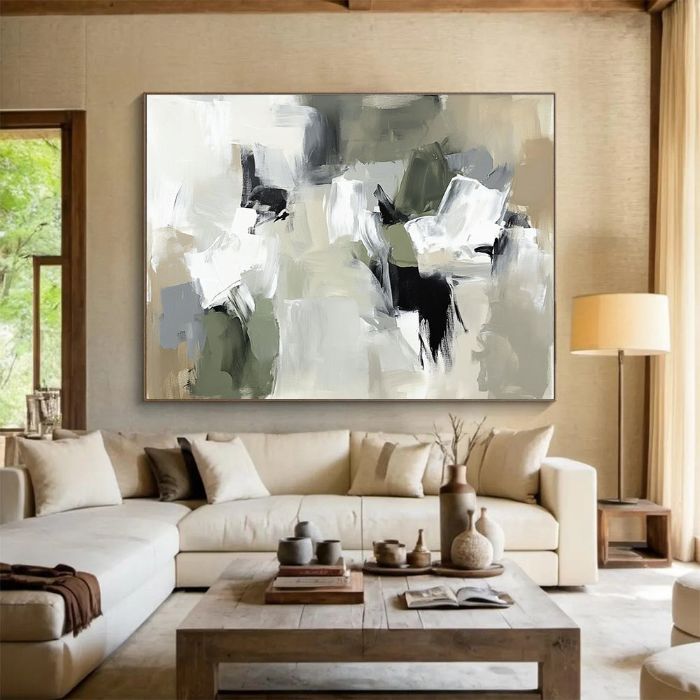 Large abstract painting in neutral tones featuring thick brush strokes and chaotic composition with beige gray and soft edges.SC245