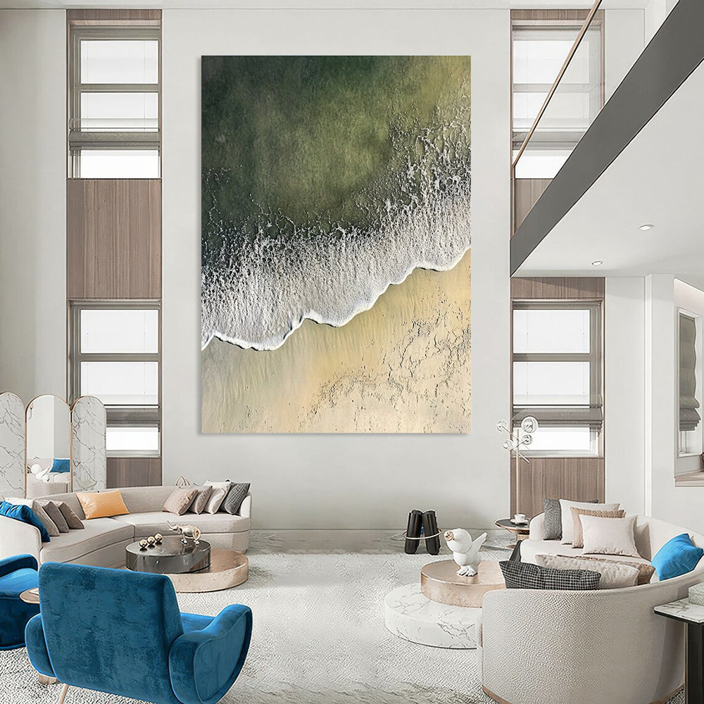Abstract painting depicting a serene coastal scene with gentle waves and soft sandy textures, blending white and gray with distant green sea hues.STSC1431