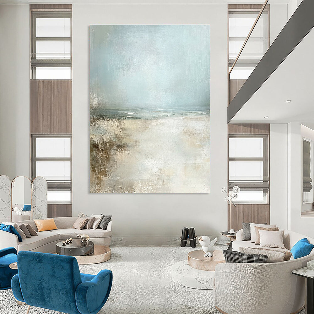 Large abstract painting featuring a serene pale blue sky and sandy beach in neutral colors for a calming ambiance.STSC095