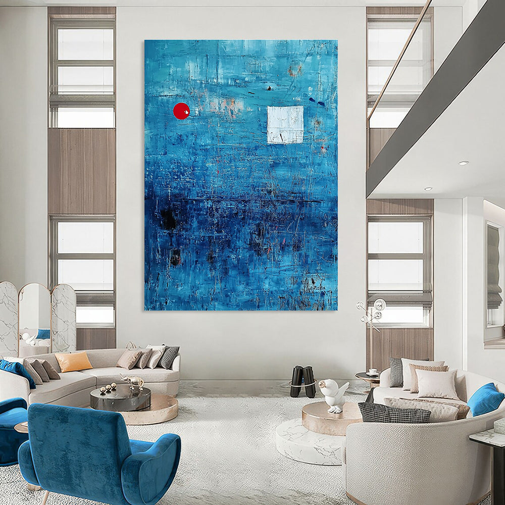 Large abstract painting featuring a serene blue ocean with textured brush strokes and dynamic black lines, accented by a small red circle and white squares.STSC041