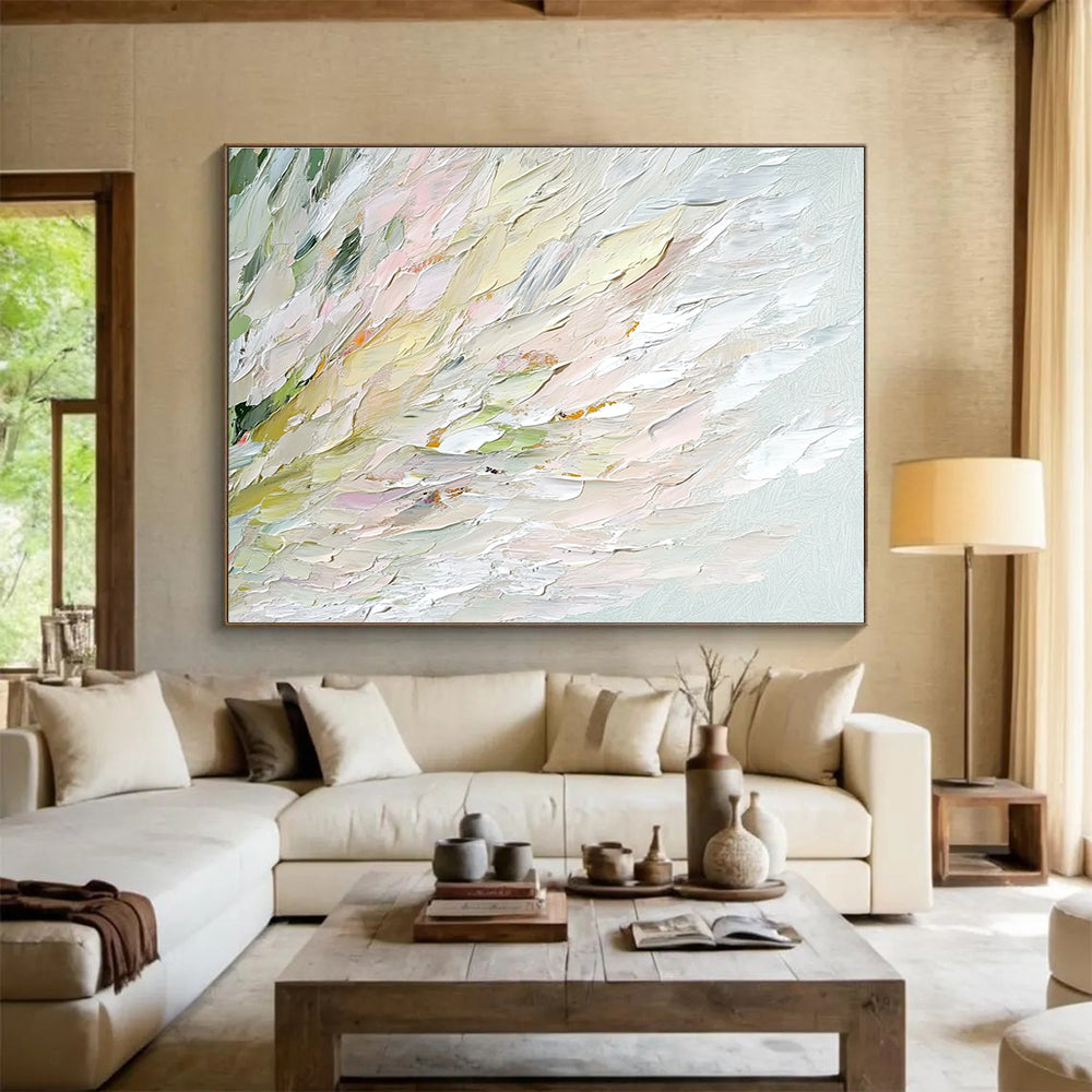 An abstract oil painting features soft swan feathers in whites greens pinks and yellows with a blurred water ripple background enhancing tranquility and elegance.SC450