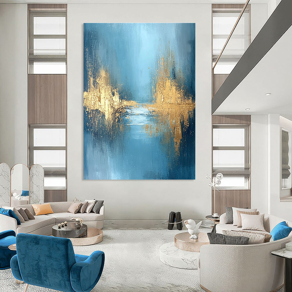 Large abstract painting featuring textured golden water and a misty morning atmosphere with blue grey and white hues for a serene mood.STSC723