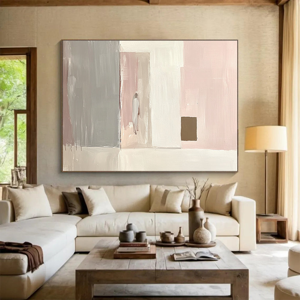 Large abstract painting in light pink and white with gray and a small brown square emphasizes minimalist brushstrokes and elegant simplicity in oil paint.SC223