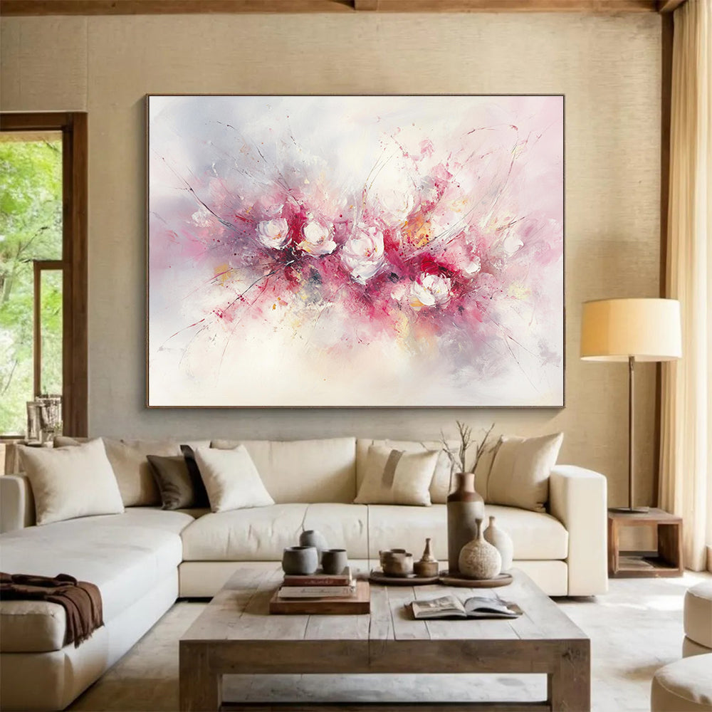 Large abstract painting of flowers in soft pink and white hues featuring bold brush strokes and delicate textures against a light background.SC191